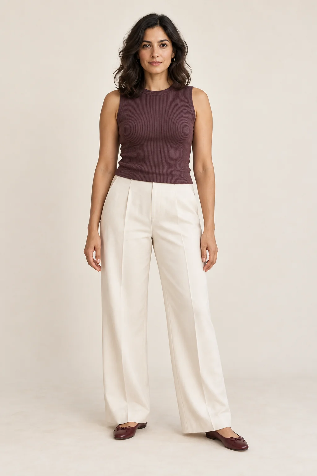 Outfit inspiration with a plum sleeveless top and ivory wide-leg trousers